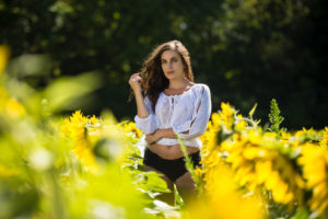 Outdoor boudoir session with sunflowers